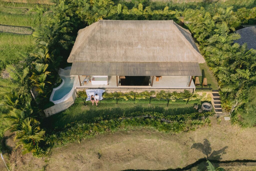 Emerald green rice terraces of Sidemen Bali with soft airy highlights and filmic texture