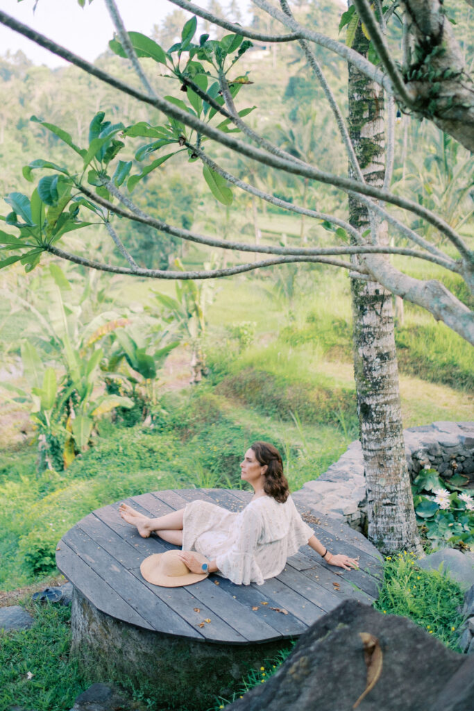 Middle-aged woman Laura solo photoshoot in ripening rice fields at Camaya Bali