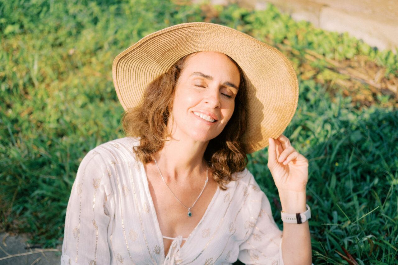 Middle-aged woman Laura solo photoshoot in ripening rice fields at Camaya Bali