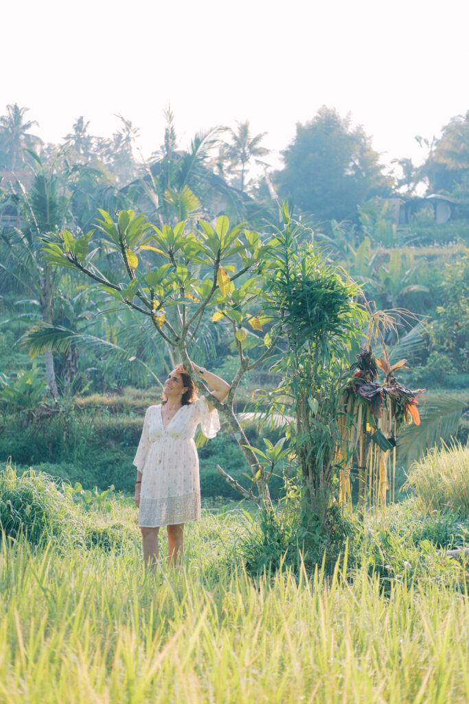 Middle-aged woman Laura solo photoshoot in ripening rice fields at Camaya Bali