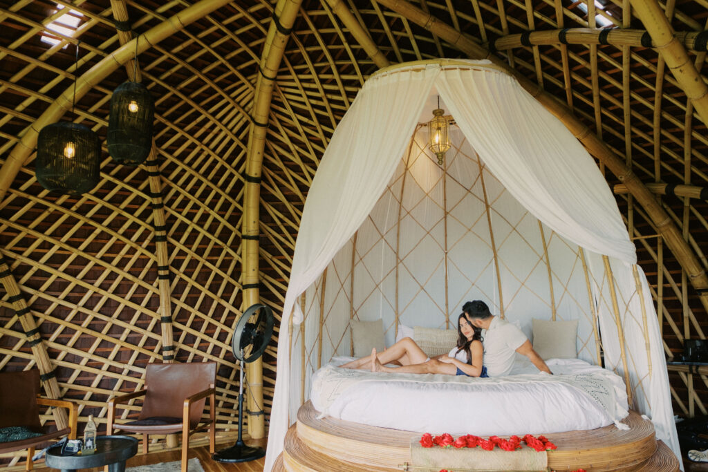 Couple enjoying a romantic getaway at Camaya Bali bamboo house.