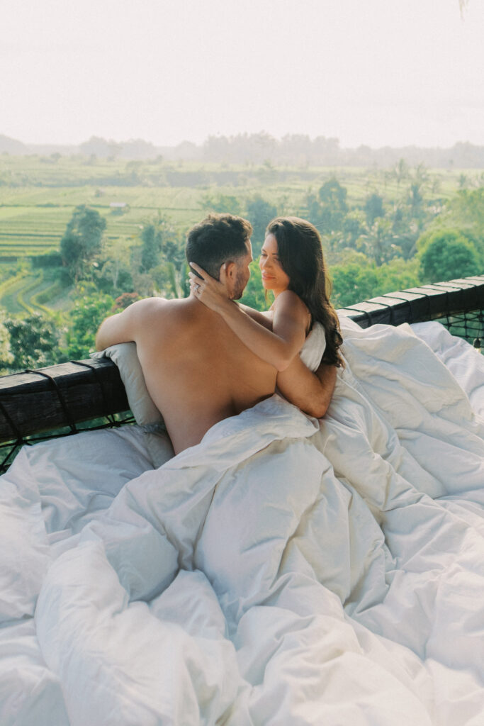 Couple enjoying a romantic getaway at Camaya Bali bamboo house.