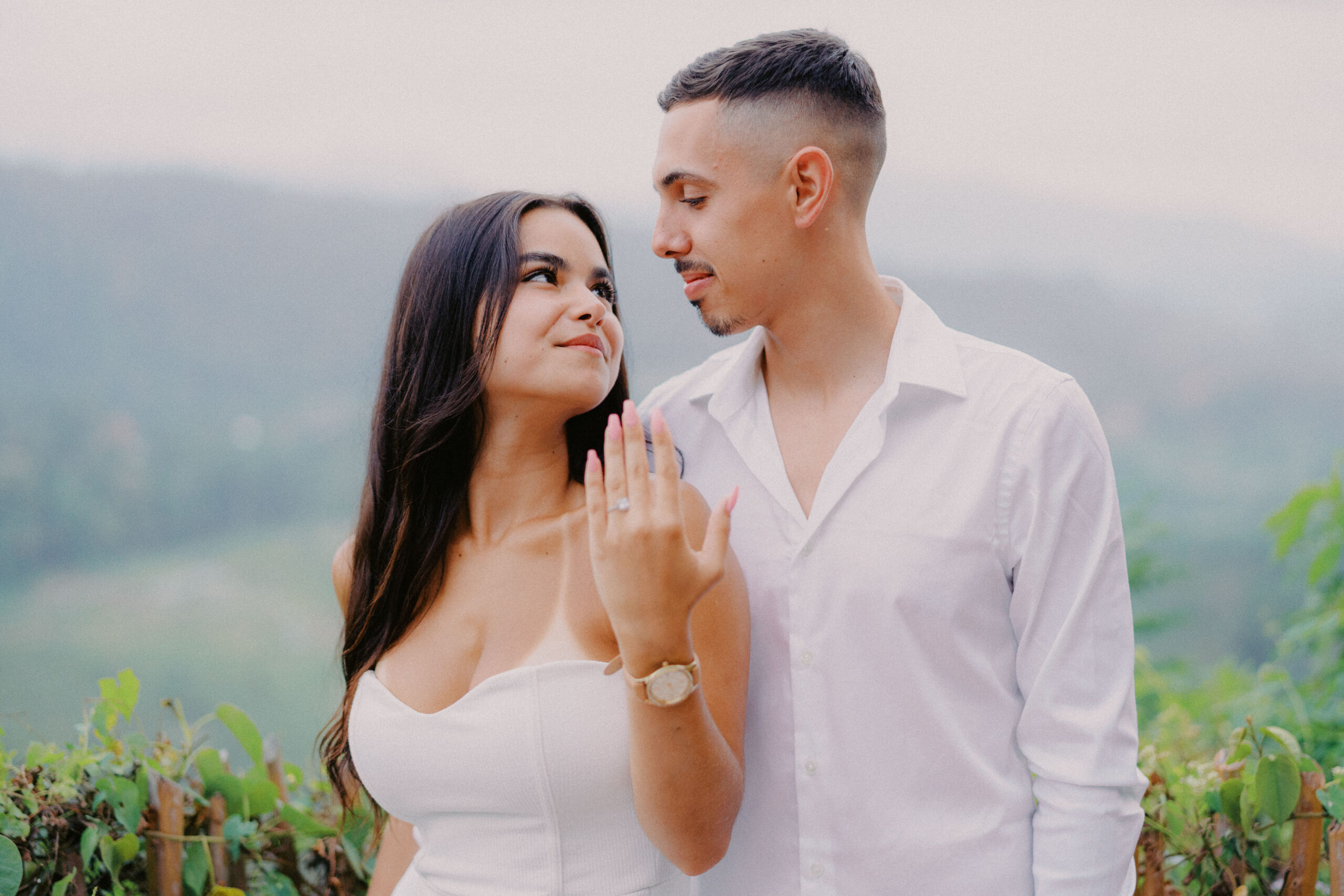 Newly engaged couple Nicholas and Sophia hugging at Avana Bamboo resort