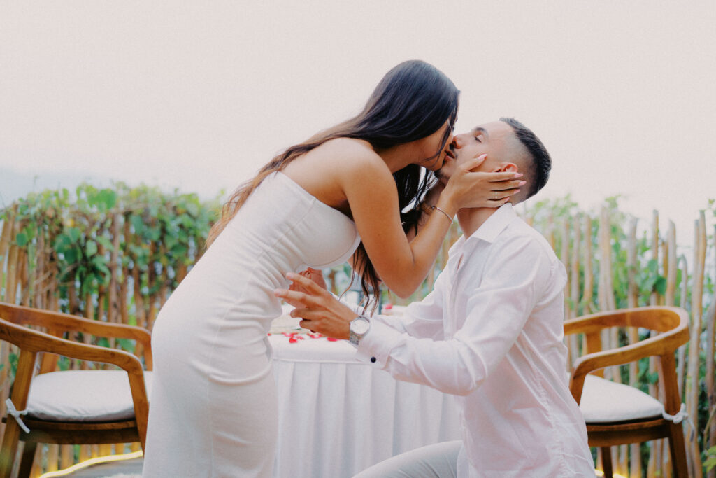 Candid moment of couple laughing during their Bali proposal photographer session